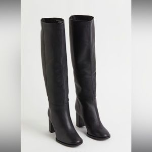 Knee high, heeled, black leather shaft boot - size 7